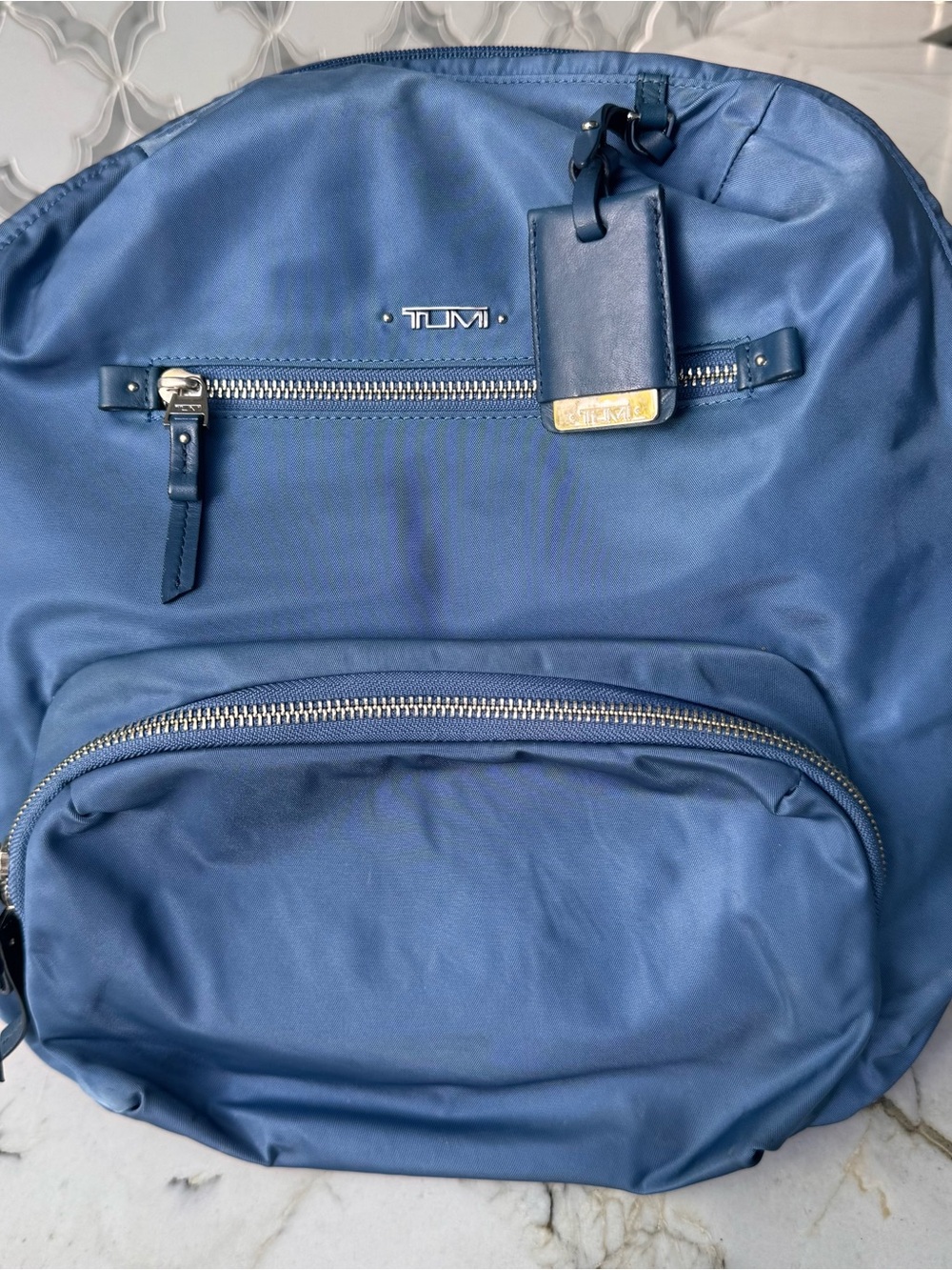 TUMI blue bag pack